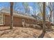 Charming brick home featuring a wooden deck and stairs leading to a private backyard at 1133 Turner Farms Rd, Garner, NC 27529