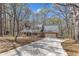 Exterior of home showcasing mature trees, extended driveway, and well-maintained landscaping at 1133 Turner Farms Rd, Garner, NC 27529
