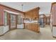 Eat-in kitchen featuring wood cabinets, tile floor, and an exterior door to the back deck at 1133 Turner Farms Rd, Garner, NC 27529