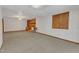 Spacious living room with brick fireplace, wood mantel, and built-in cabinet at 1133 Turner Farms Rd, Garner, NC 27529