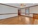 Hardwood floor in living room with fireplace and natural light at 1133 Turner Farms Rd, Garner, NC 27529