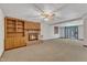 Cozy living room with brick fireplace, built-in shelving, and sliding doors to the outdoors at 1133 Turner Farms Rd, Garner, NC 27529