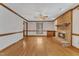Light-filled living room featuring hardwood floors, brick fireplace at 1133 Turner Farms Rd, Garner, NC 27529