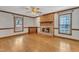 Inviting living room features brick fireplace, hardwood floors, and natural light at 1133 Turner Farms Rd, Garner, NC 27529