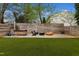 Back yard features a hot tub, fire pit, and artificial turf, perfect for outdoor entertainment and relaxation at 1208 Garner Rd, Raleigh, NC 27610