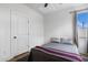 Bedroom with hardwood floors and a large closet at 1208 Garner Rd, Raleigh, NC 27610