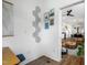 Inviting entryway featuring modern decor, unique wall art, and a glimpse into the open-concept kitchen and living space at 1208 Garner Rd, Raleigh, NC 27610