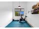 Bright exercise room with workout equipment and a window providing natural light for a motivating fitness space at 1208 Garner Rd, Raleigh, NC 27610