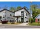 Beautiful modern home featuring a manicured front yard, a stylish driveway, and impeccable curb appeal at 1208 Garner Rd, Raleigh, NC 27610