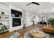 Open living space features a fireplace, built-in shelves, and seamless flow to the dining area at 1208 Garner Rd, Raleigh, NC 27610