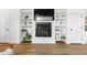 Cozy living room boasts a fireplace, built-in shelves, and natural light at 1208 Garner Rd, Raleigh, NC 27610