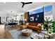 Open concept living room with sleek ceiling fan, spacious seating area, and modern decor at 1208 Garner Rd, Raleigh, NC 27610