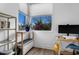 Bright office space with large windows, modern desk, and shelving with plants, perfect for a productive workspace at 1208 Garner Rd, Raleigh, NC 27610