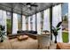Comfortable screened porch with stylish furniture, ceiling fan, and a cozy atmosphere for relaxation at 1208 Garner Rd, Raleigh, NC 27610