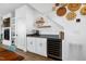 Stylish wet bar features custom cabinetry, wine fridge, and elegant decor at 1208 Garner Rd, Raleigh, NC 27610