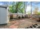 Fully fenced backyard featuring a storage shed and gravel and brick groundcover at 1210 Ventura Springs Ct, Wake Forest, NC 27587
