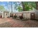 Fully fenced backyard featuring a storage shed and gravel and brick groundcover at 1210 Ventura Springs Ct, Wake Forest, NC 27587