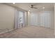 A bright bedroom with a ceiling fan, a window and two closets providing lots of storage space at 1210 Ventura Springs Ct, Wake Forest, NC 27587
