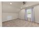 Cozy bedroom with neutral carpet, window, fan and a sloped ceiling creating a quiet retreat at 1210 Ventura Springs Ct, Wake Forest, NC 27587