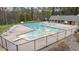 An elevated view of the community pool and clubhouse with lots of seating and manicured landscaping at 1210 Ventura Springs Ct, Wake Forest, NC 27587