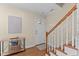 Welcoming foyer with staircase and decorative accents, setting a stylish tone at 1210 Ventura Springs Ct, Wake Forest, NC 27587
