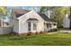 Side view of the home with a bay window and manicured landscaping at 1210 Ventura Springs Ct, Wake Forest, NC 27587