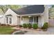 Close up of the home's front exterior and porch with neat landscaping at 1210 Ventura Springs Ct, Wake Forest, NC 27587