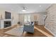 Inviting living room with fireplace, hardwood floors, and abundant natural light at 1210 Ventura Springs Ct, Wake Forest, NC 27587