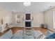 Airy living room with a fireplace, providing a comfortable space for relaxation and entertainment at 1210 Ventura Springs Ct, Wake Forest, NC 27587