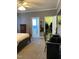 Bedroom with walk-in closet, ensuite bathroom, ceiling fan and neutral tones at 126 W Quail Ridge Rd, Oxford, NC 27565