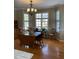 Inviting dining room with hardwood floors and large windows at 126 W Quail Ridge Rd, Oxford, NC 27565