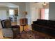 Inviting living room with hardwood floors, neutral walls, and an open view to the kitchen at 126 W Quail Ridge Rd, Oxford, NC 27565