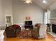 Comfortable living room with a fireplace, hardwood floors, and a view of the mantel and furniture at 126 W Quail Ridge Rd, Oxford, NC 27565