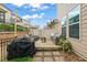 Backyard deck with patio furniture, grill, and string lights at 1524 Catch Fly Ln, Durham, NC 27713