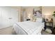 Comfortable bedroom features a ceiling fan and a view of the ensuite bathroom at 1524 Catch Fly Ln, Durham, NC 27713