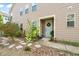 Charming home exterior with a light blue front door, a Welcome sign, and lovely landscaping at 1524 Catch Fly Ln, Durham, NC 27713