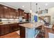 Beautiful kitchen with granite countertops, custom cabinetry, and an open view to the adjacent living spaces at 1524 Catch Fly Ln, Durham, NC 27713