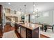 Open-concept kitchen with granite counters, stainless steel appliances, and an inviting breakfast area at 1524 Catch Fly Ln, Durham, NC 27713