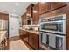 Modern kitchen features stainless steel appliances, granite countertops and dark wood cabinetry at 1524 Catch Fly Ln, Durham, NC 27713