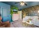 Stylish living room with statement wallpaper, a modern cabinet, and comfortable seating at 1524 Catch Fly Ln, Durham, NC 27713
