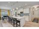 Bright, open kitchen with a quartz island, white cabinetry, and stainless steel appliances at 160 Bruce Dr, Dunn, NC 28334
