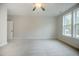 Spacious carpeted bedroom with great natural light and a standard closet at 185 W Amber Oak Dr, Selma, NC 27576
