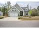 Charming one-story home with a manicured lawn, two-car garage, and a welcoming entrance at 185 W Amber Oak Dr, Selma, NC 27576