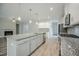 Beautiful kitchen featuring an island, granite countertops, stainless appliances, and lots of storage space at 185 W Amber Oak Dr, Selma, NC 27576