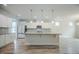 Modern kitchen with an island, stainless steel appliances, and abundant counter space, perfect for cooking at 185 W Amber Oak Dr, Selma, NC 27576