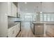 Stylish kitchen with an island, stainless steel appliances, granite counters, and a seamless connection to dining area at 185 W Amber Oak Dr, Selma, NC 27576