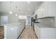 Spacious kitchen boasts an island, stainless steel appliances, granite countertops, and ample cabinet space at 185 W Amber Oak Dr, Selma, NC 27576
