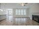 Inviting living room with a cozy fireplace and natural light, seamlessly flowing into adjacent spaces at 185 W Amber Oak Dr, Selma, NC 27576