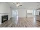 Bright, open-concept living space features a fireplace and modern finishes, ready for personalized touches at 185 W Amber Oak Dr, Selma, NC 27576