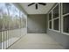 Screened-in porch with ceiling fan, offering relaxing outdoor living and views of the backyard at 185 W Amber Oak Dr, Selma, NC 27576